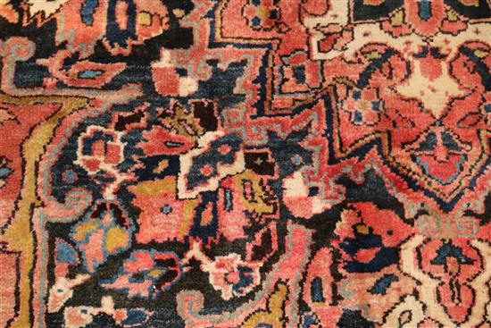 A Persian red ground carpet with pole medallion 372 x 255cm